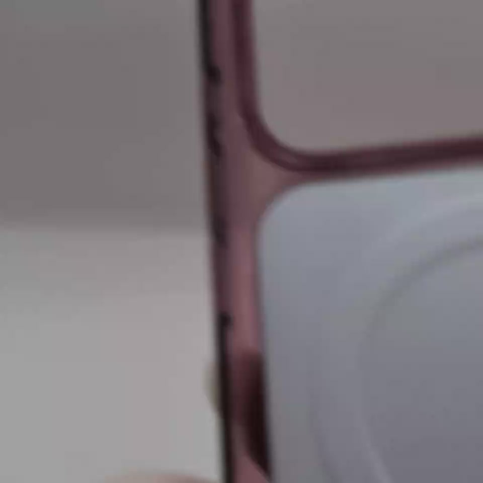 Video of  translucent burgundy  phone 18 case with a rose gold bumper frame, shown on an iPhone against a plain white background.