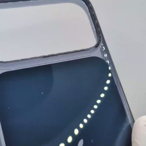 Video dark navy blue phone 18 case with a clear bumper frame, shown on the back of an iPhone. The Apple logo is visible in the center, and the case has a transparent camera cutout at the top.