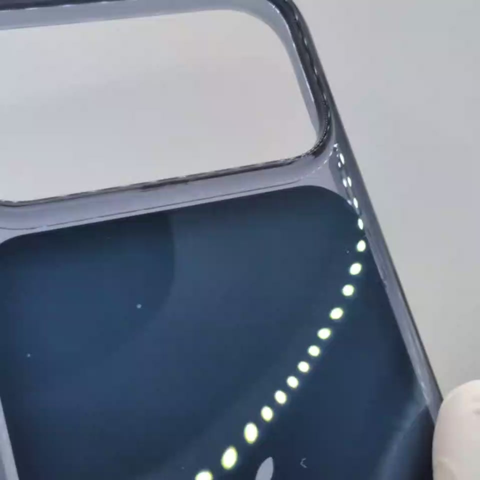 Video dark navy blue phone 18 case with a clear bumper frame, shown on the back of an iPhone. The Apple logo is visible in the center, and the case has a transparent camera cutout at the top.