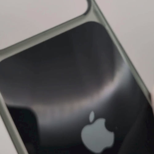 Video black iphone 18 case demo with a silver metallic bumper frame and a silver Apple logo in the center, shown on a plain white background.